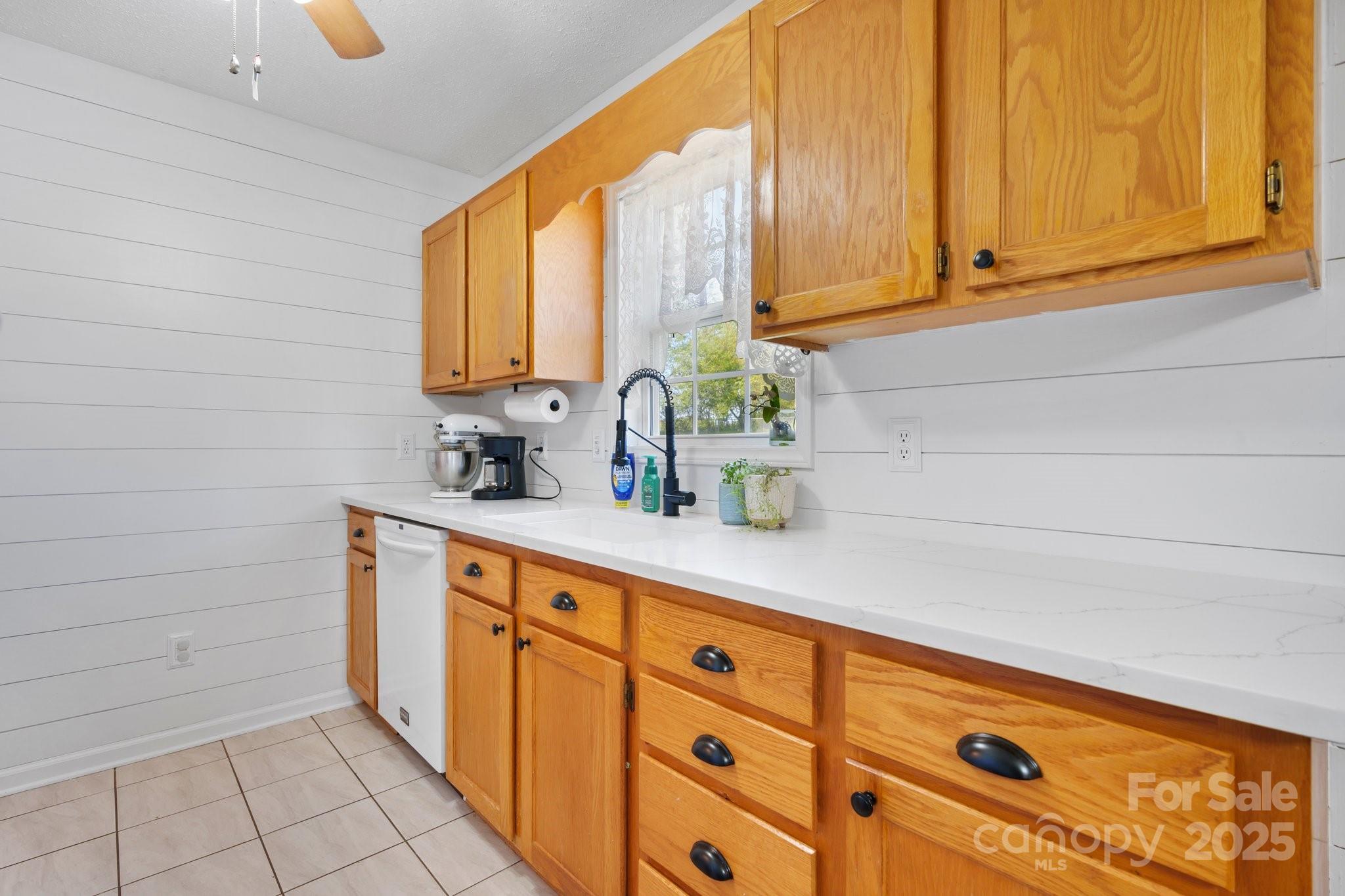 5184 Swinging Bridge Road Conover, NC 28613 - Photo 8 of 38 a kitchen with stainless steel appliances a sink and cabinets