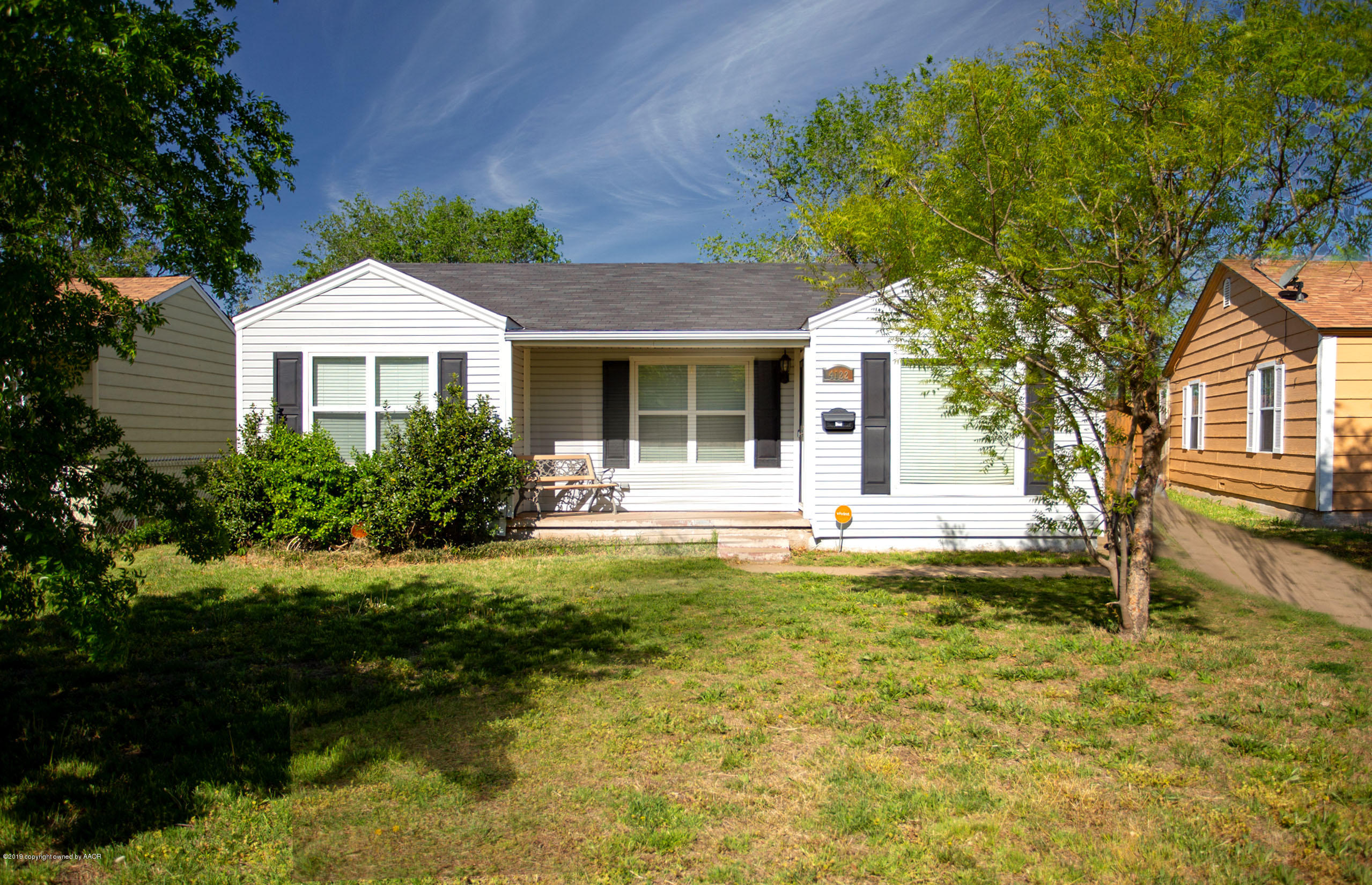 4122 South Travis Street Amarillo, TX 79110 - Photo 1 of 18 a swimming pool with outdoor seating and yard