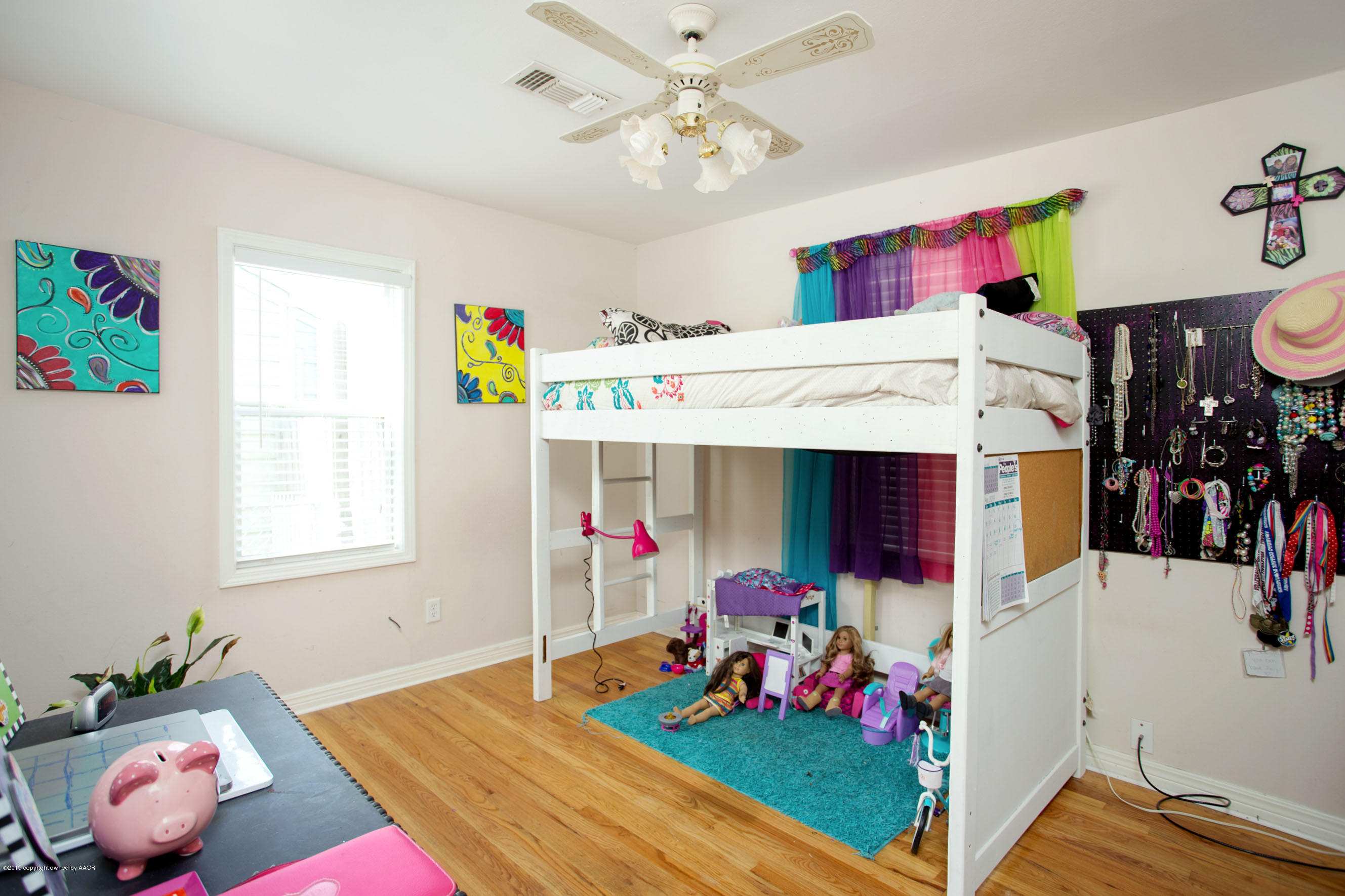 4122 South Travis Street Amarillo, TX 79110 - Photo 14 of 18 a bed room with a bed and a window