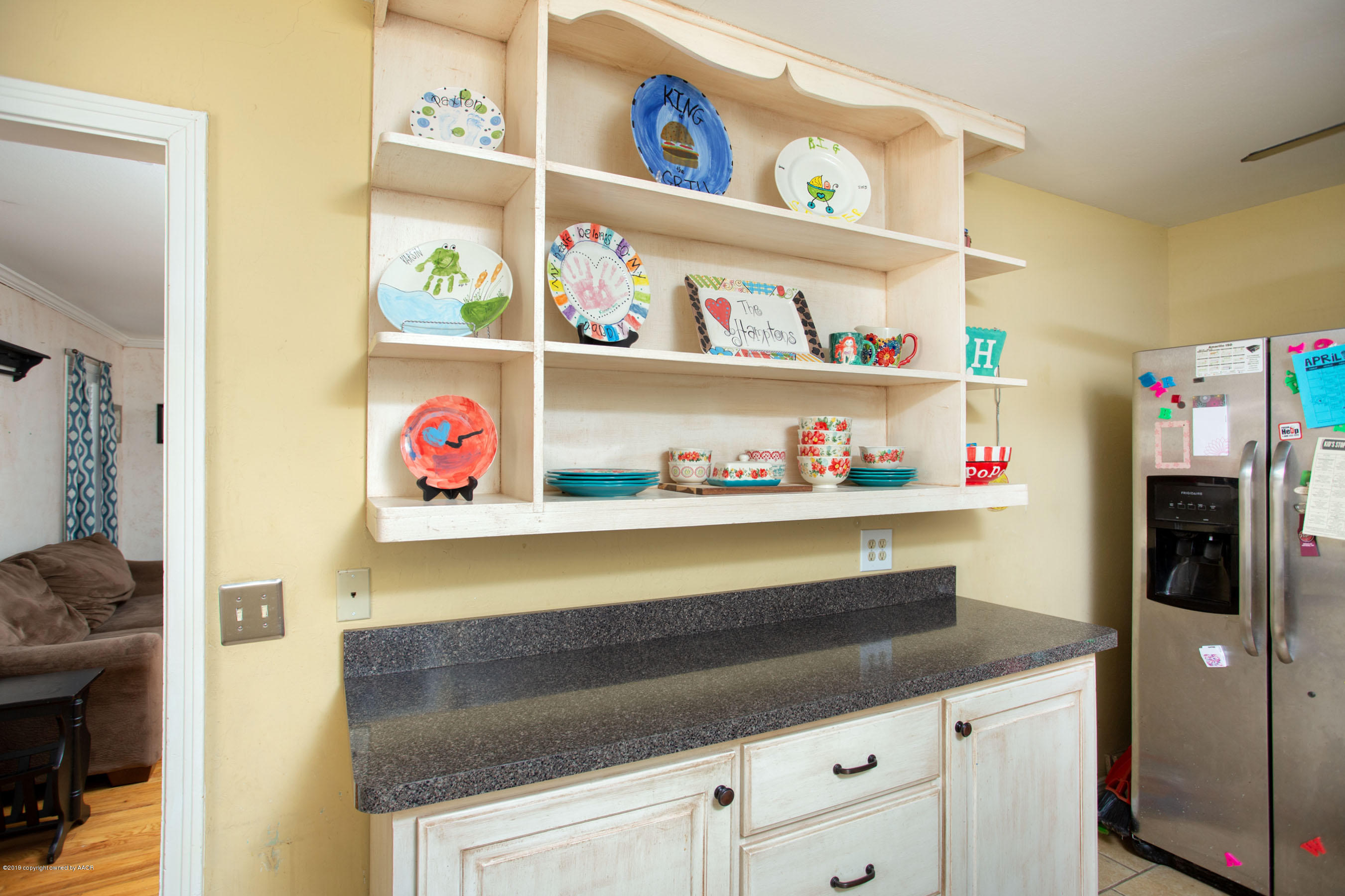 4122 South Travis Street Amarillo, TX 79110 - Photo 7 of 18 a utility room with lots of clutter and cabinets