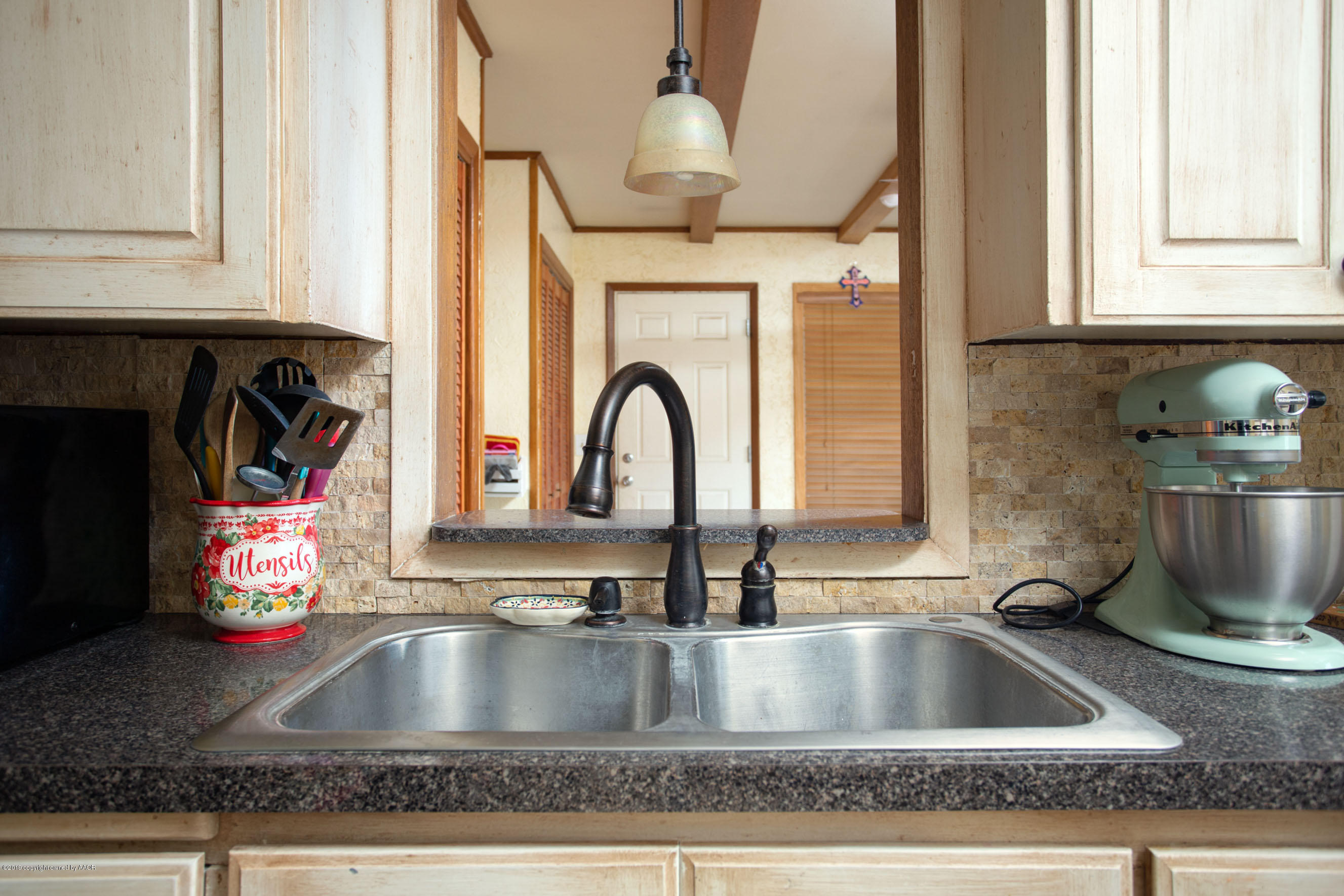 4122 South Travis Street Amarillo, TX 79110 - Photo 8 of 18 a close view of sink and tap