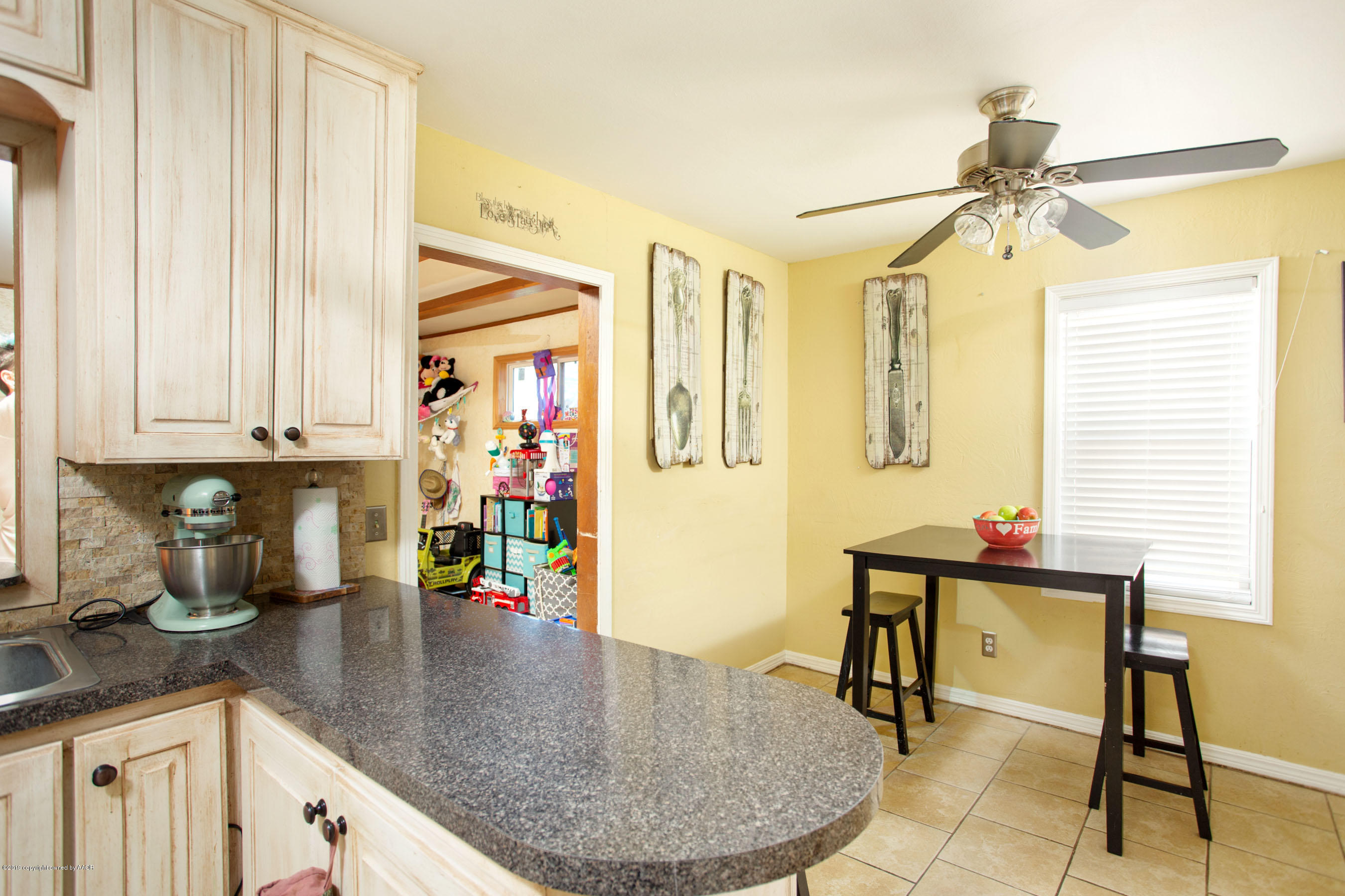 4122 South Travis Street Amarillo, TX 79110 - Photo 9 of 18 a kitchen with stainless steel appliances granite countertop a sink and cabinets