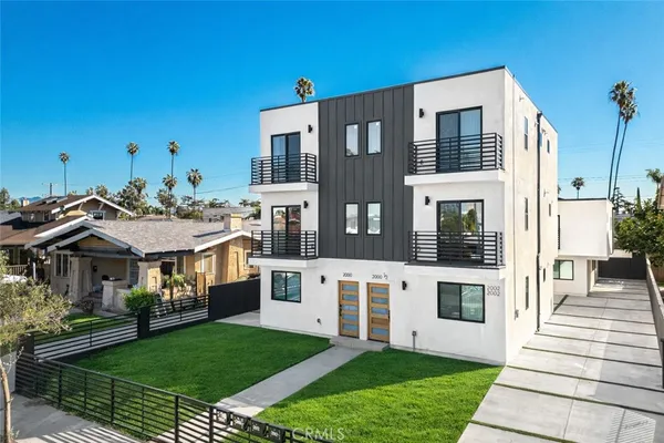 a view of house with a yard