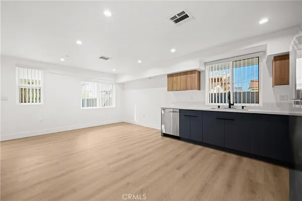 a kitchen with a sink and window