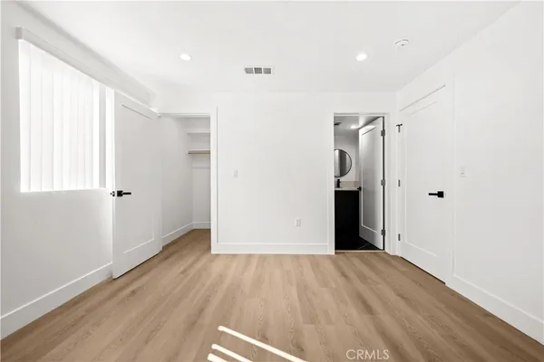 a view of hallway with wooden floor