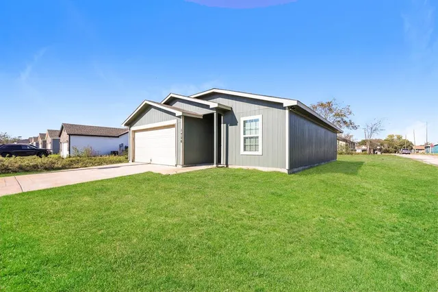 a house view with a backyard space