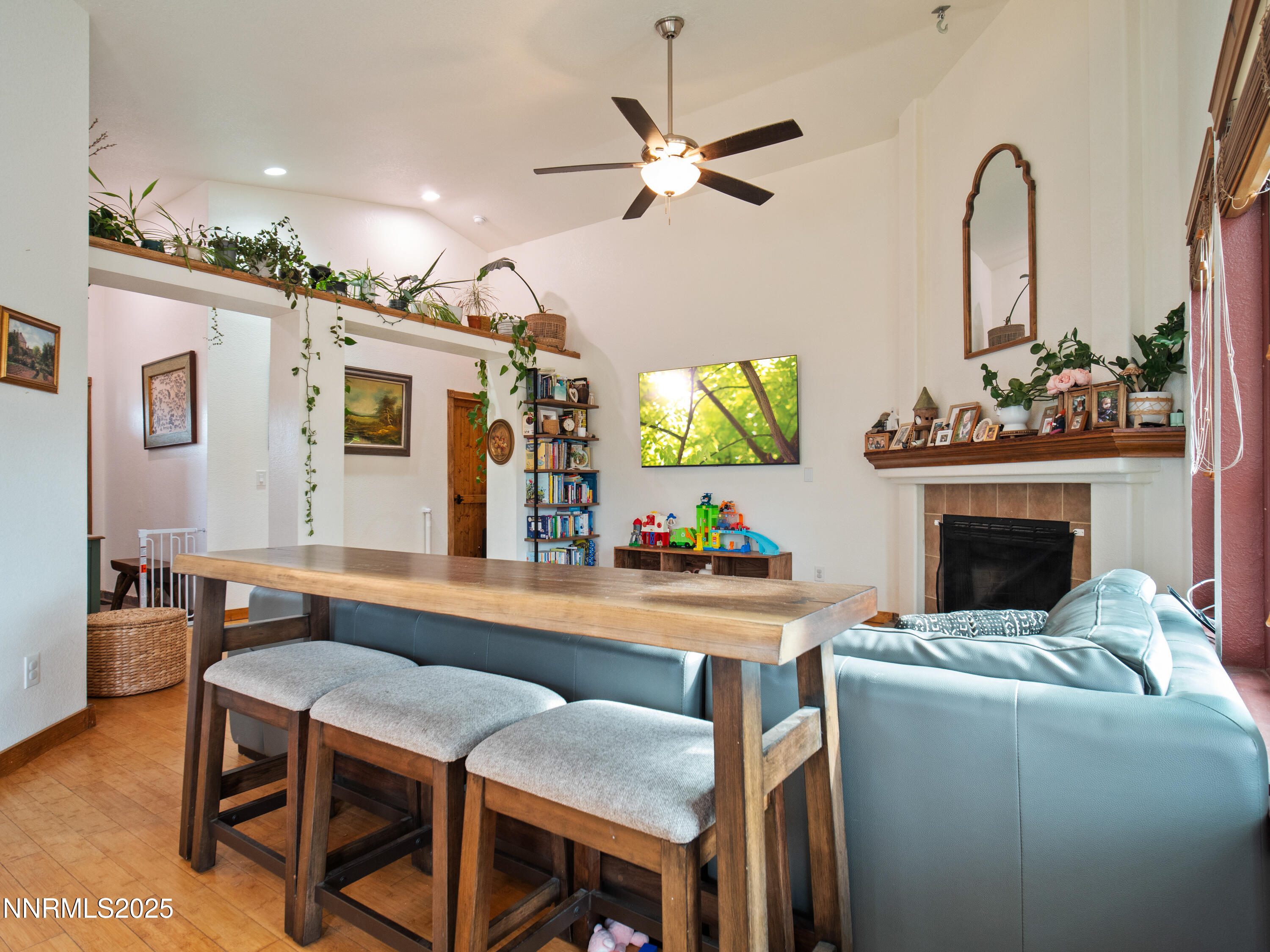 1263 Bronco Circle Minden, NV 89423 - Photo 12 of 33 a dinning table and a fireplace in a room