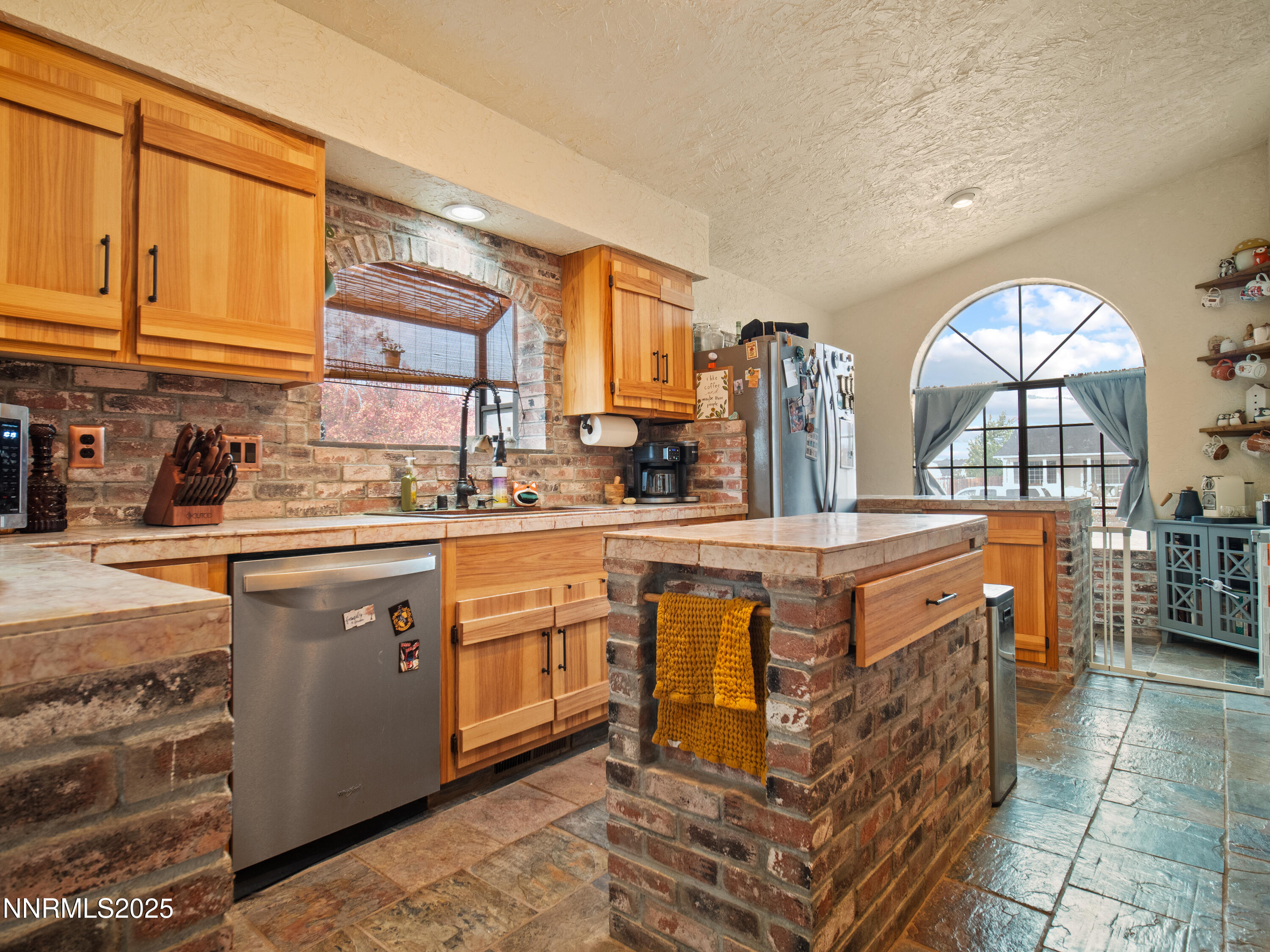 1263 Bronco Circle Minden, NV 89423 - Photo 14 of 33 a kitchen with stainless steel appliances granite countertop a sink stove and cabinets