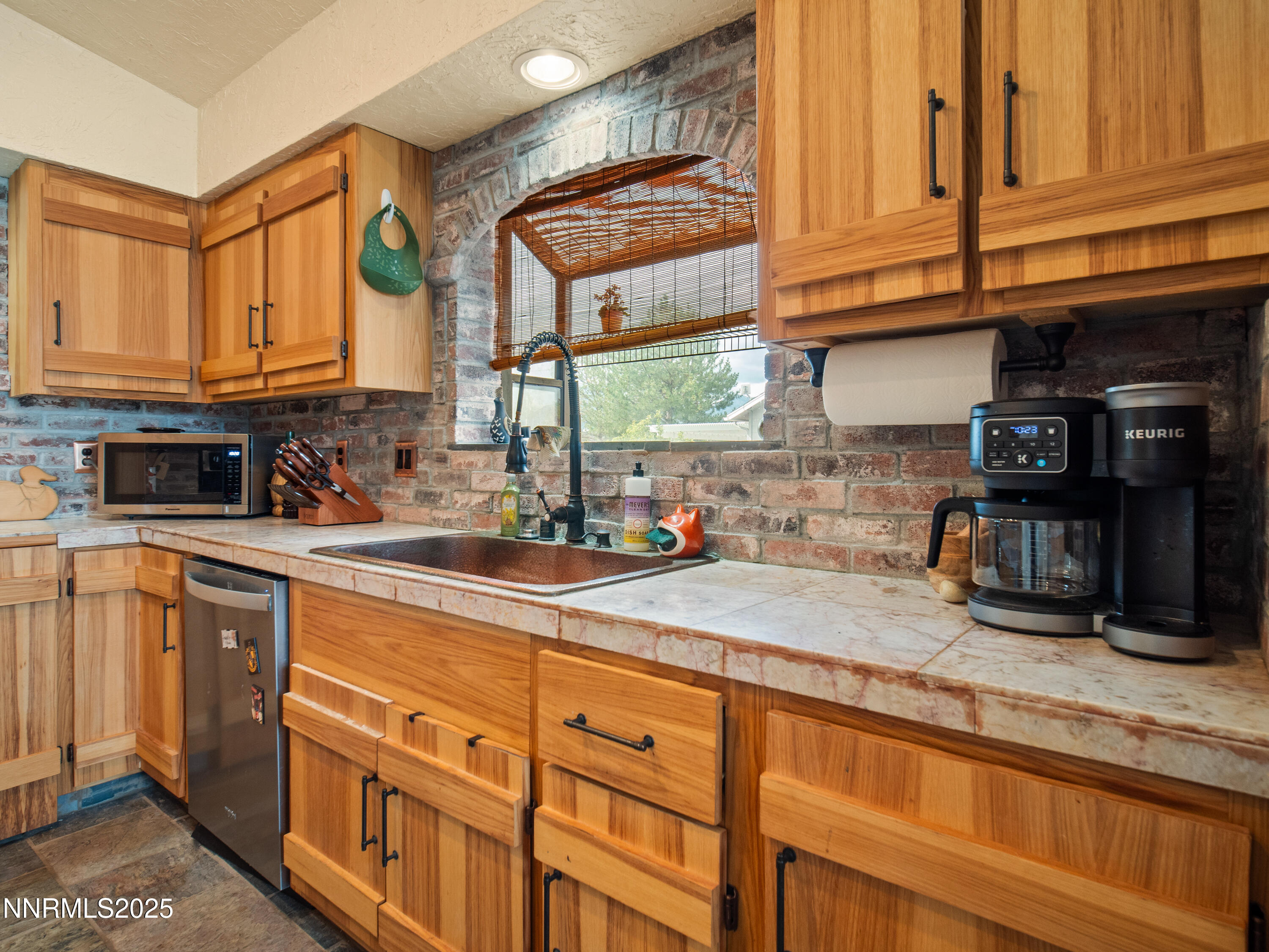 1263 Bronco Circle Minden, NV 89423 - Photo 17 of 33 a kitchen with stainless steel appliances granite countertop a sink and cabinets