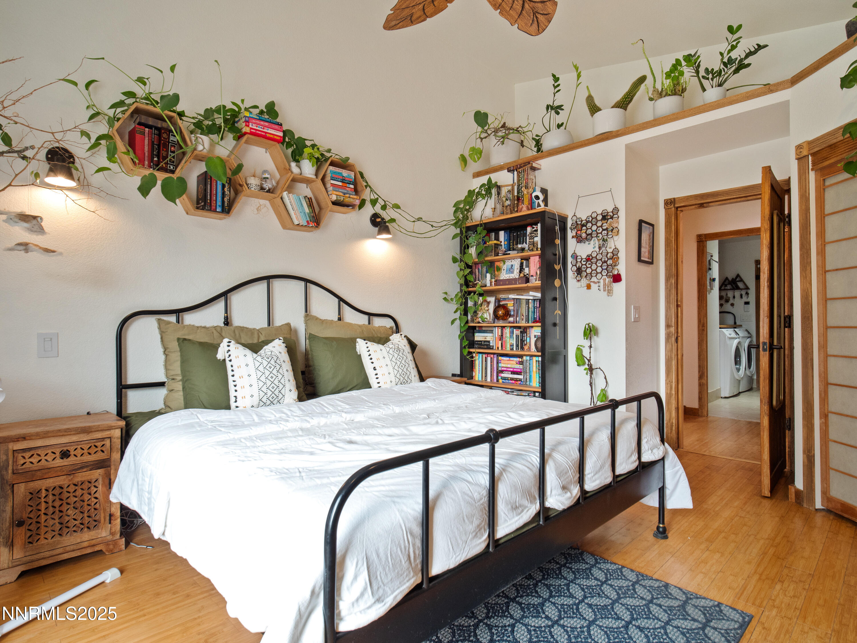 1263 Bronco Circle Minden, NV 89423 - Photo 20 of 33 a bedroom with a bed a books bucket with a table in it