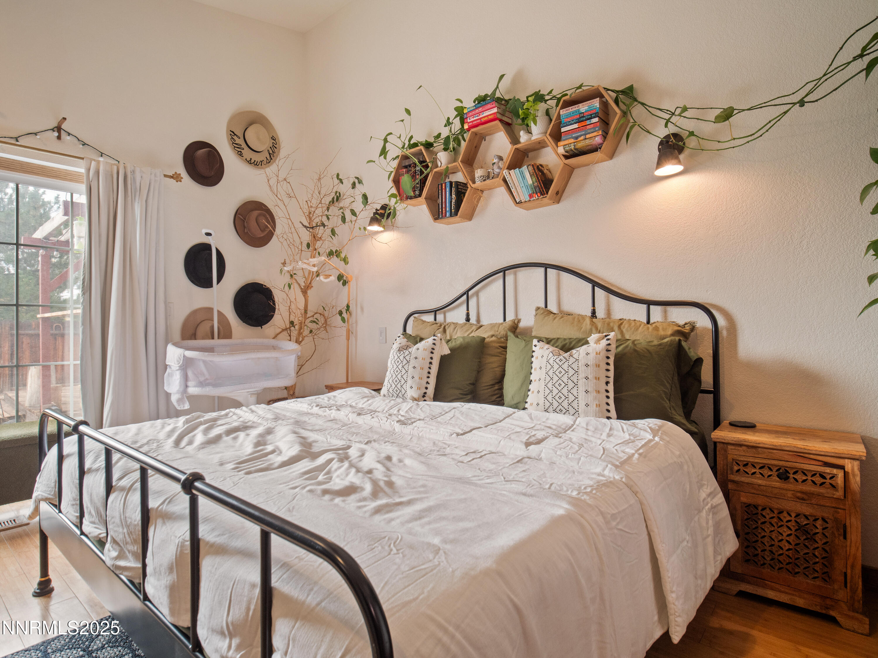 1263 Bronco Circle Minden, NV 89423 - Photo 21 of 33 a bedroom with a bed and wooden floor