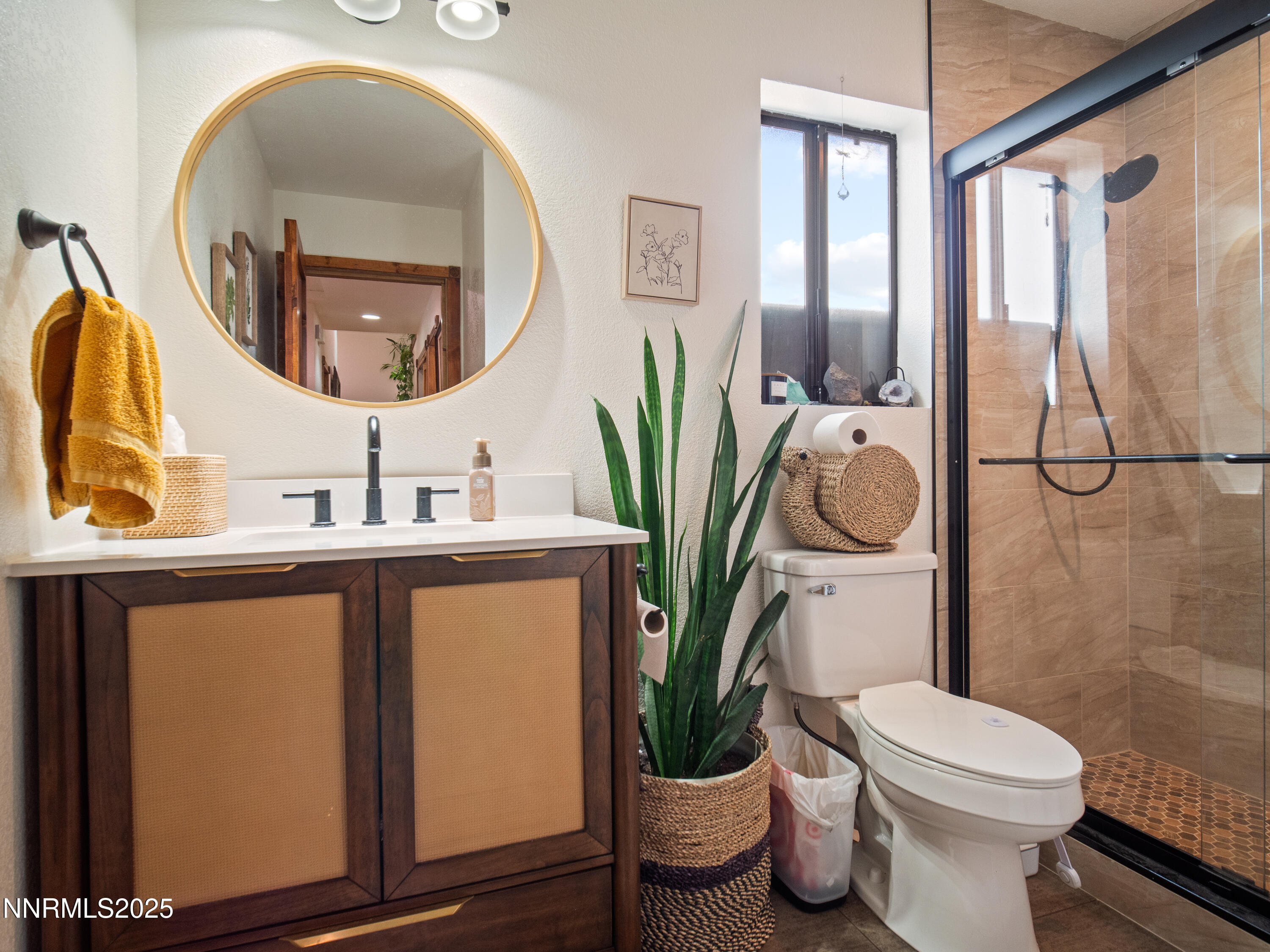 1263 Bronco Circle Minden, NV 89423 - Photo 27 of 33 a bathroom with a toilet a sink and a mirror