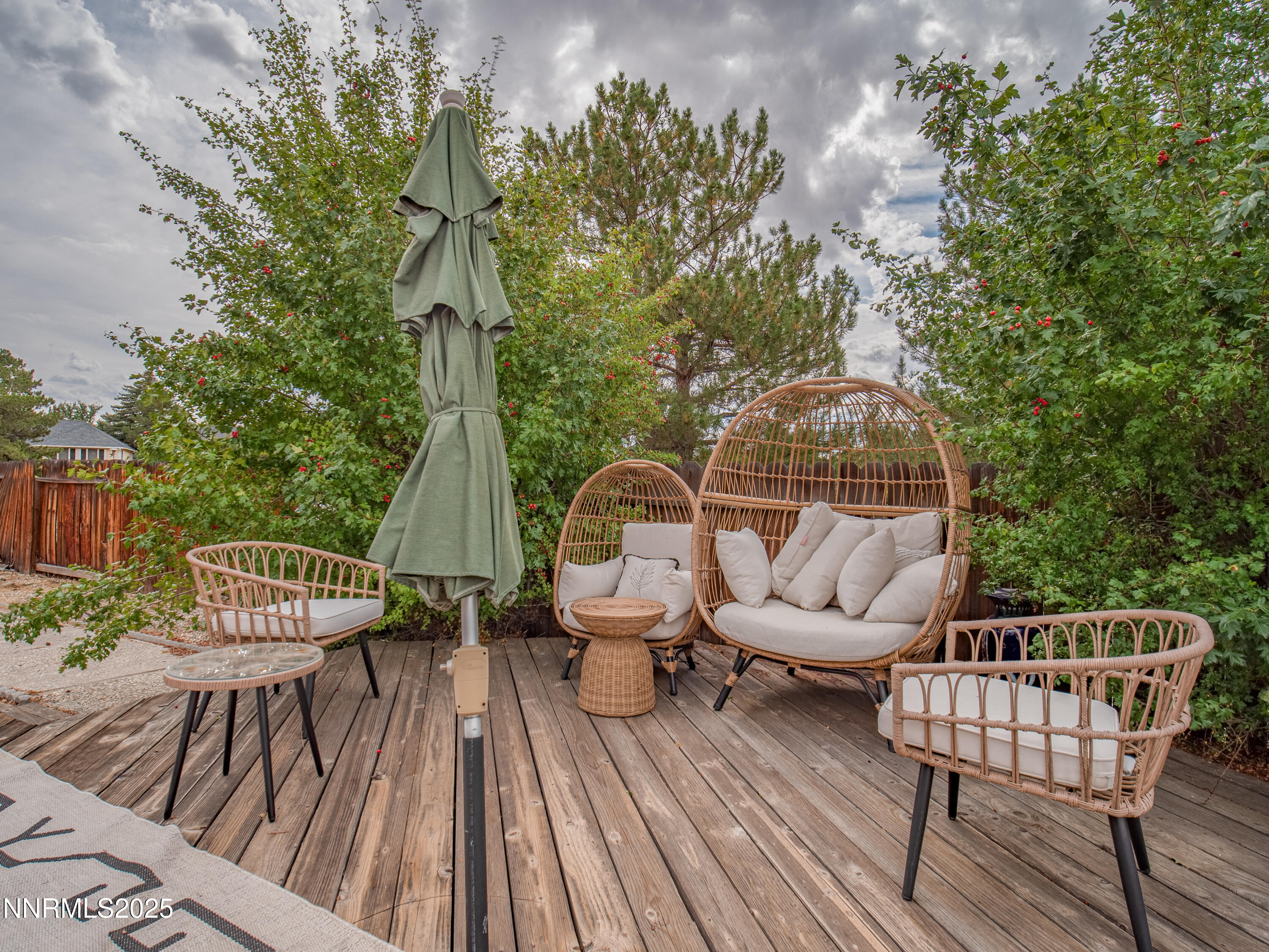 1263 Bronco Circle Minden, NV 89423 - Photo 32 of 33 an outdoor sitting area with furniture and wooden floor