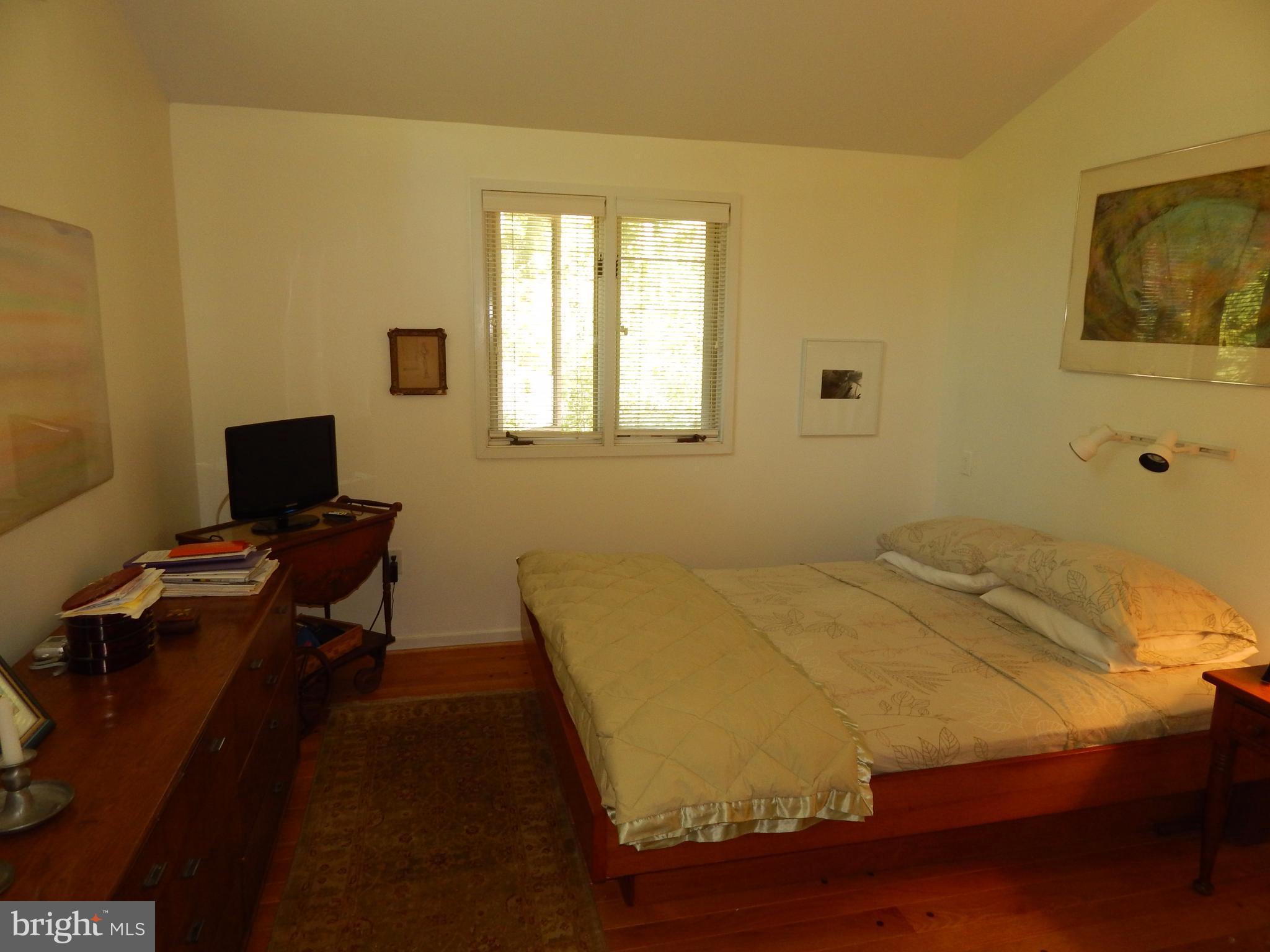 4017 Easterbell Road Port Republic, MD 20676 - Photo 11 of 30 a bedroom with a bed and a window