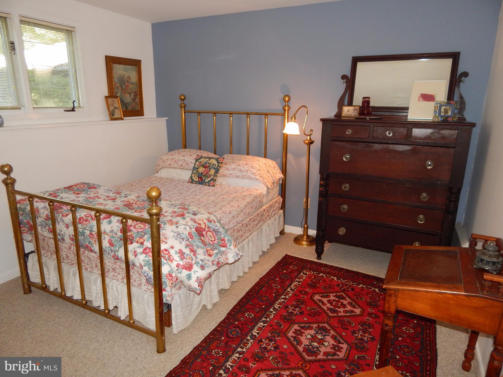 4017 Easterbell Road Port Republic, MD 20676 - Photo 13 of 30 a bedroom with a bed and wooden floor