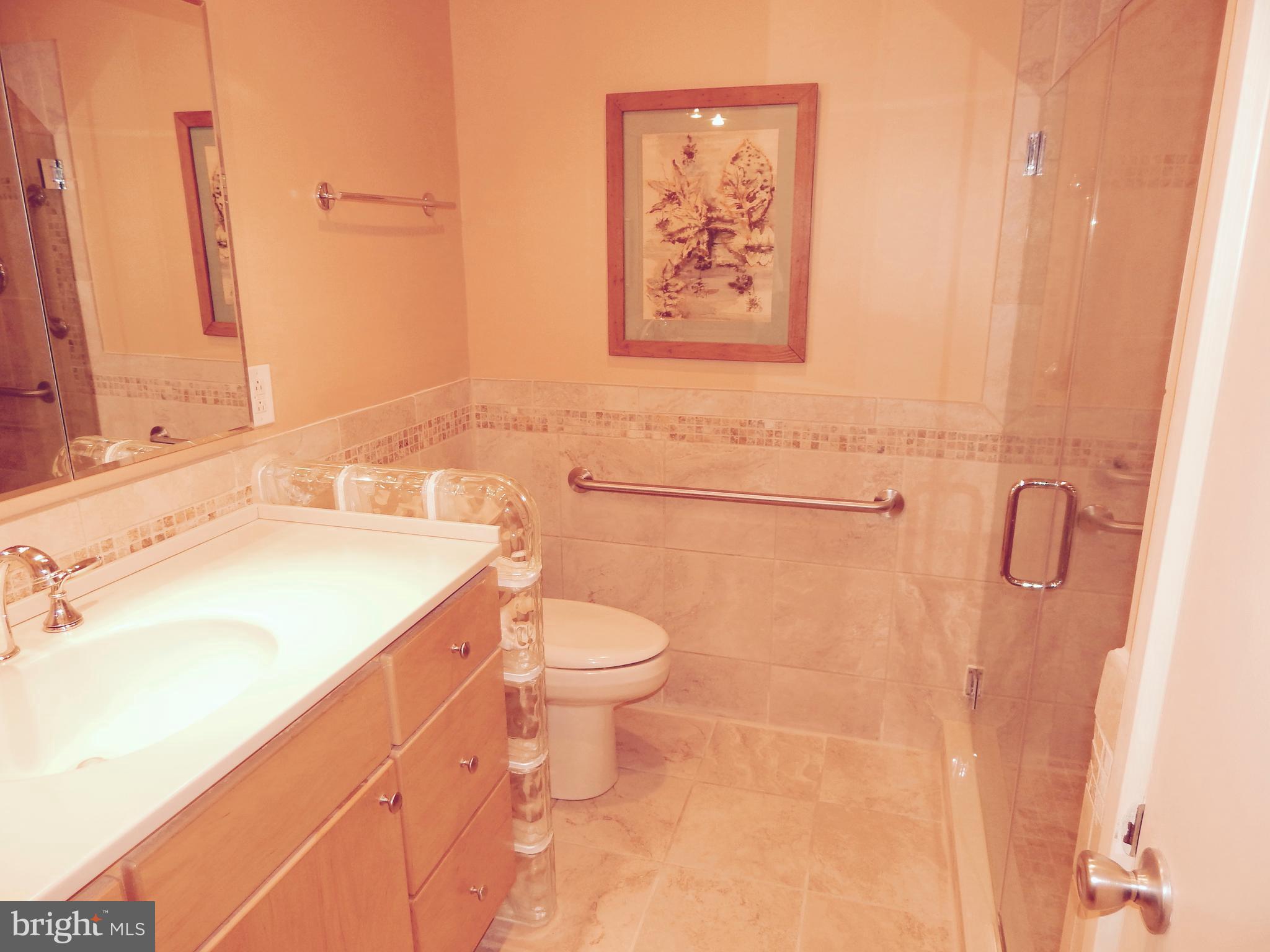 4017 Easterbell Road Port Republic, MD 20676 - Photo 17 of 30 a bathroom with a sink mirror vanity and toilet