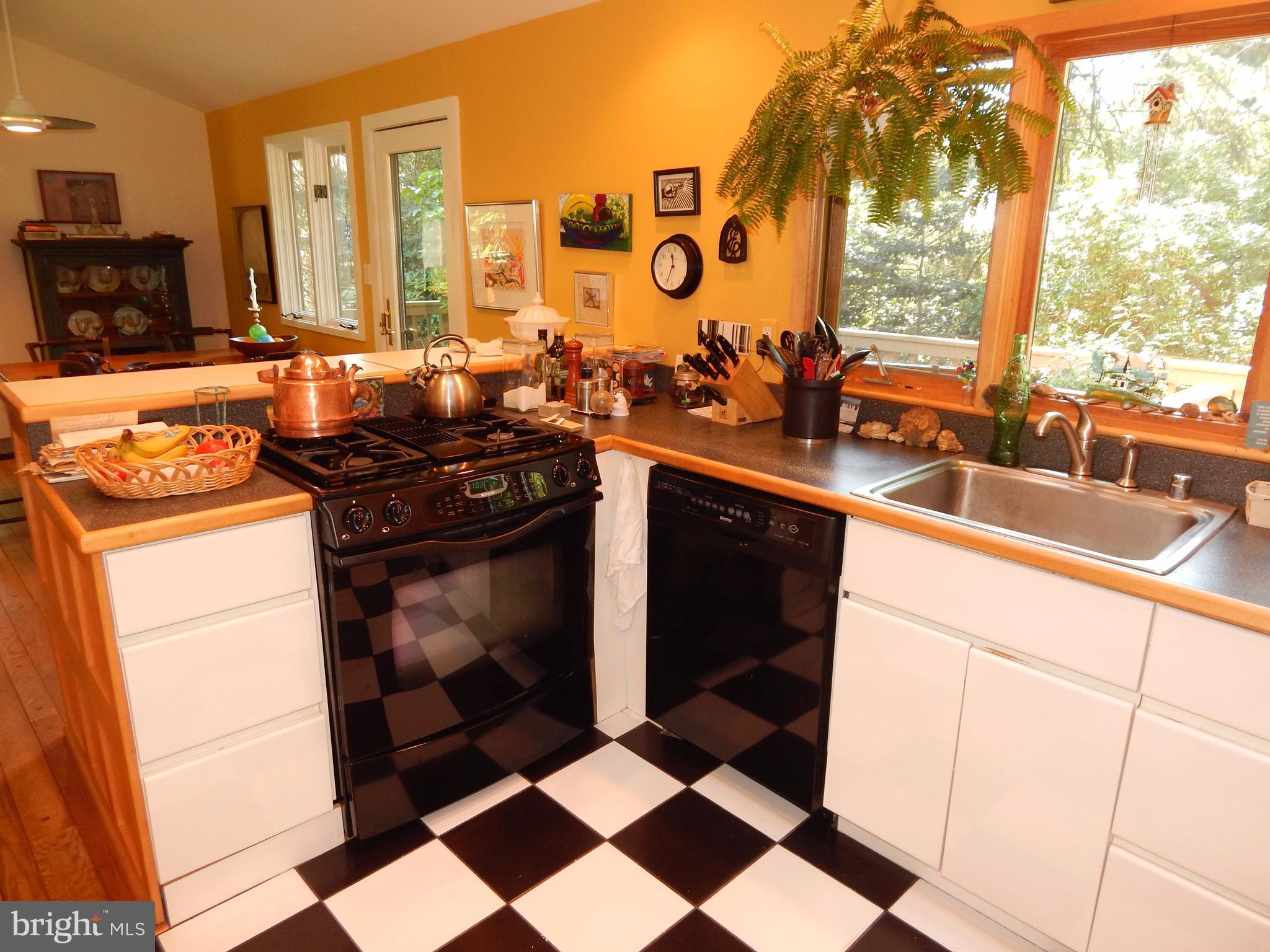 4017 Easterbell Road Port Republic, MD 20676 - Photo 7 of 30 a kitchen with a stove a sink and a refrigerator