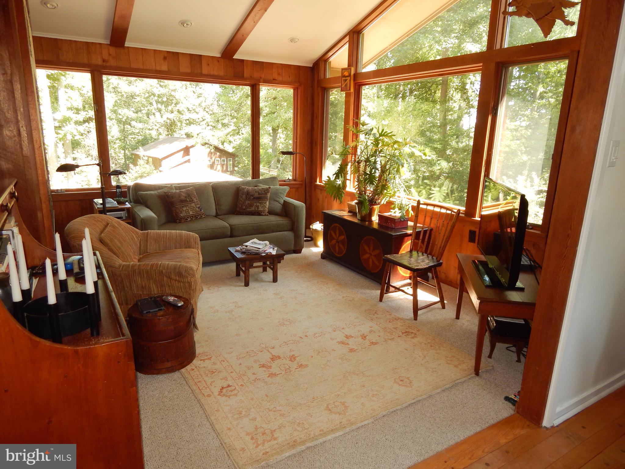 4017 Easterbell Road Port Republic, MD 20676 - Photo 9 of 30 a living room with furniture and floor to ceiling windows