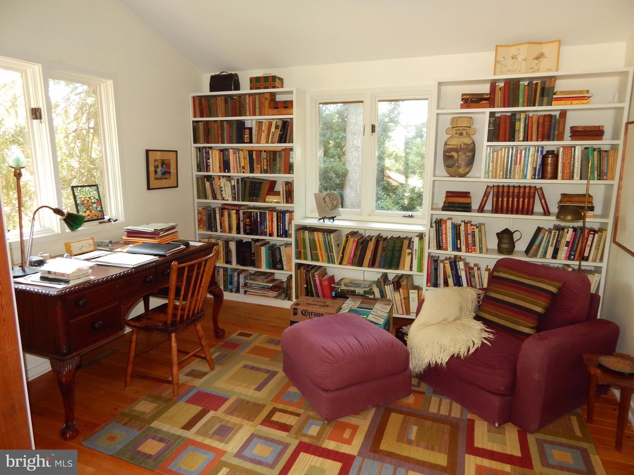 4017 Easterbell Road Port Republic, MD 20676 - Photo 10 of 30 a living room with furniture and a bookshelf