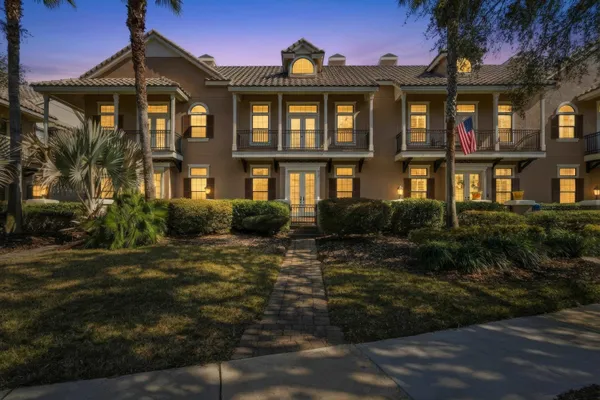 a spacious bedroom with a bed and a window