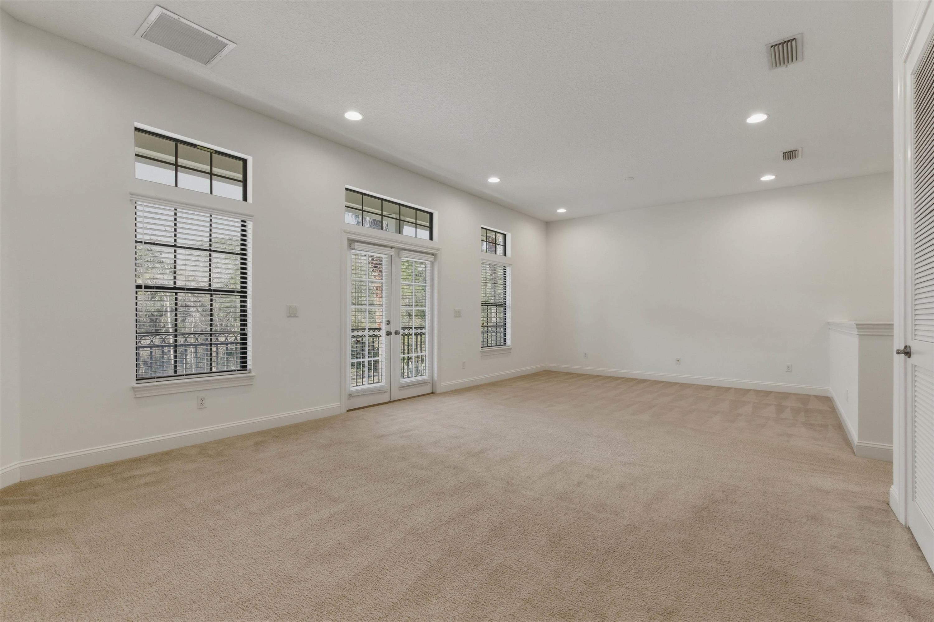 654 South Loop Parkway St. Augustine, FL 32095 - Photo 32 of 76 an empty room with windows