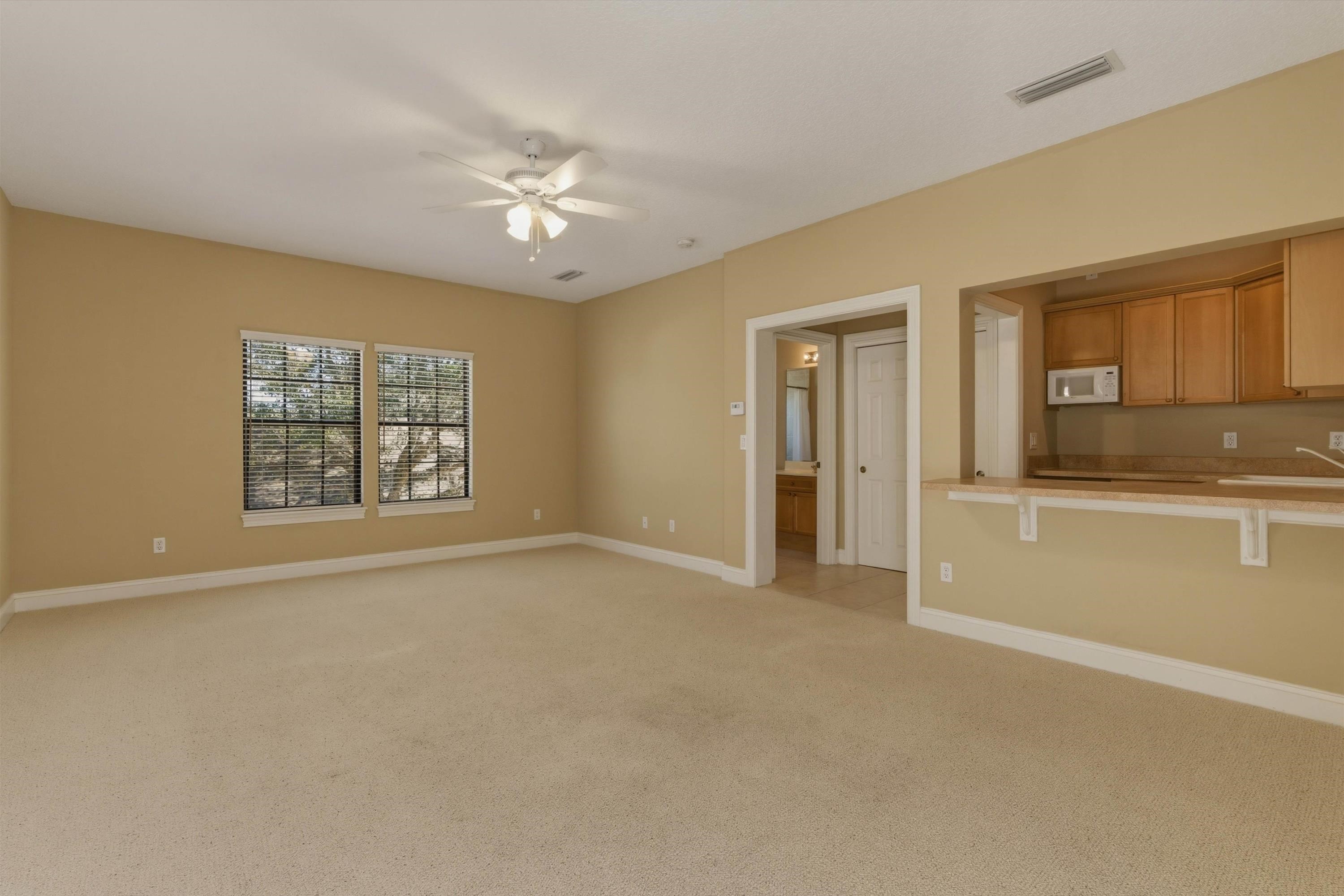 654 South Loop Parkway St. Augustine, FL 32095 - Photo 9 of 76 a view of an empty room with a window