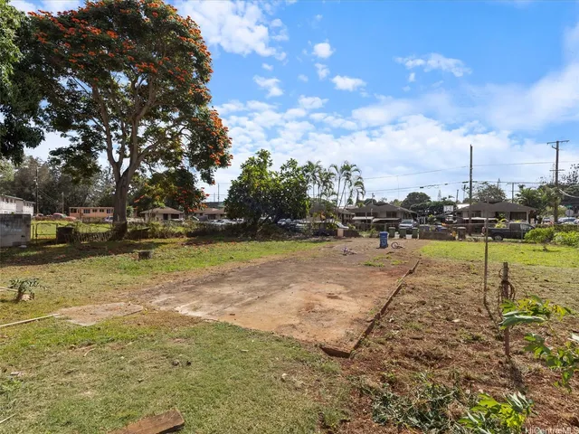 a view of a yard with swimming pool