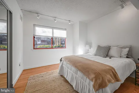 a bedroom with a bed and a view of bedroom