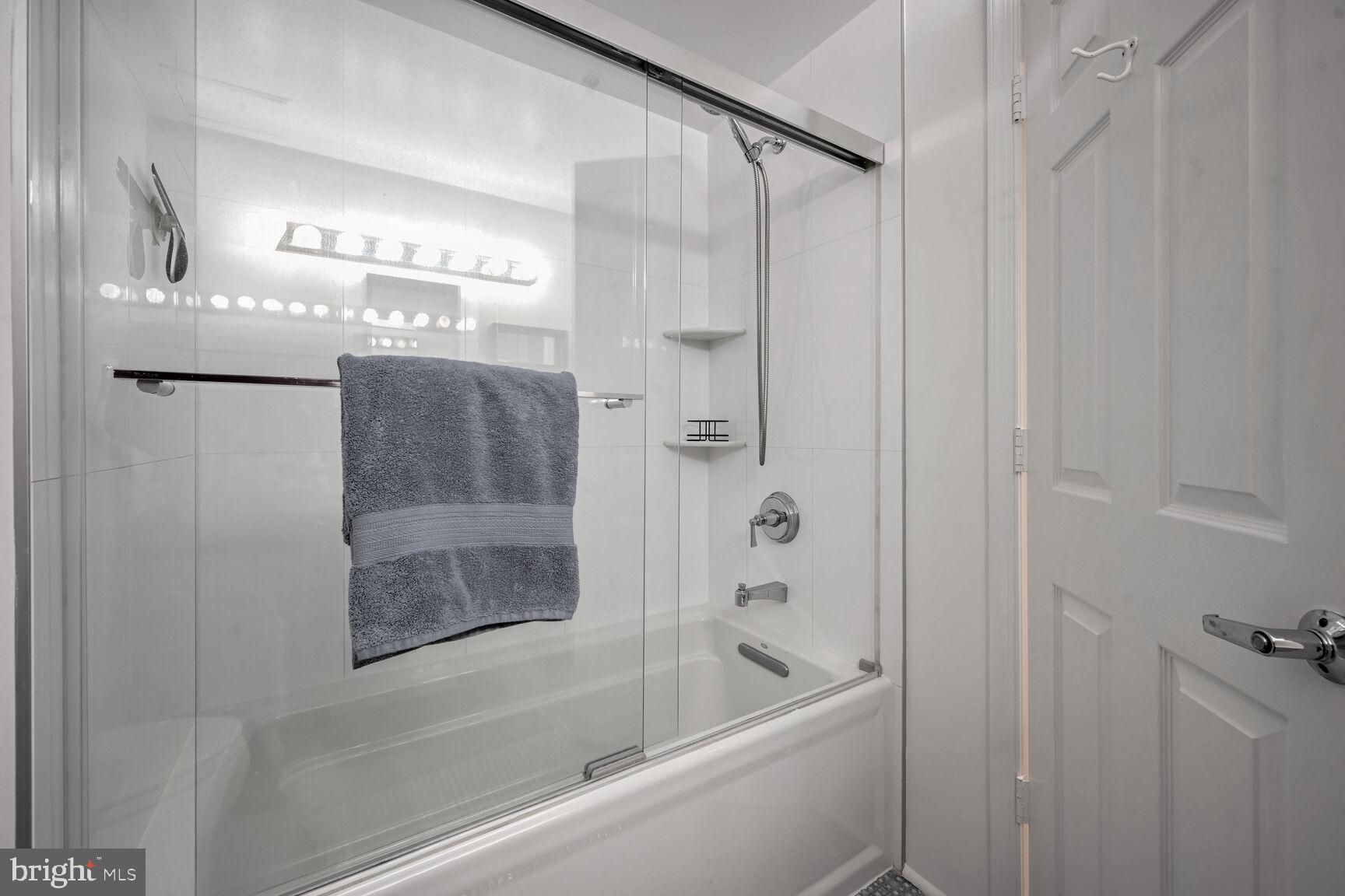 2301 N Street Northwest, Unit 104 Washington, DC 20037 - Photo 18 of 22 a bathroom with a bathtub and a shower