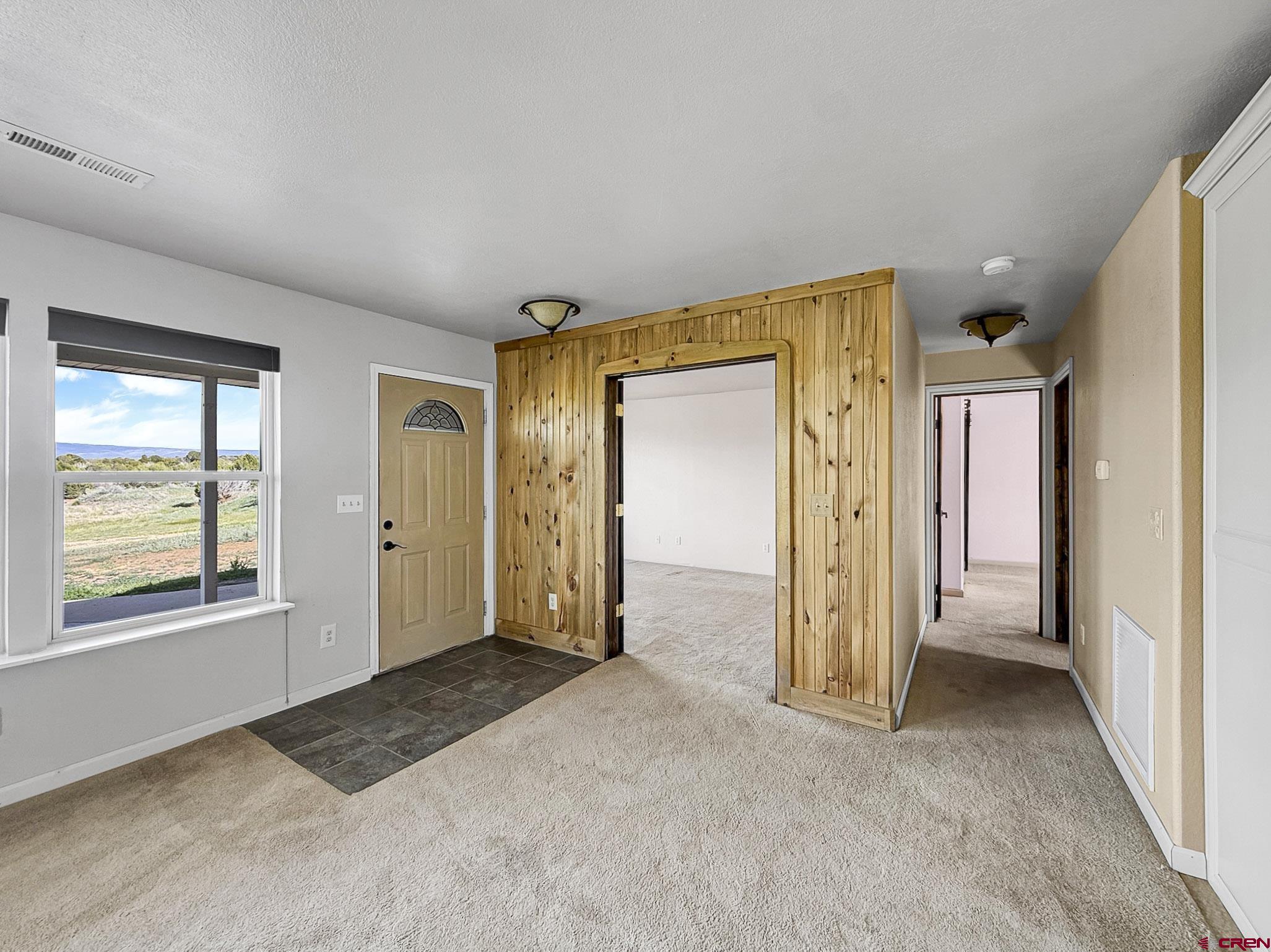 32310 B50 Road Crawford, CO 81415 - Photo 23 of 45 an empty room with windows and closet
