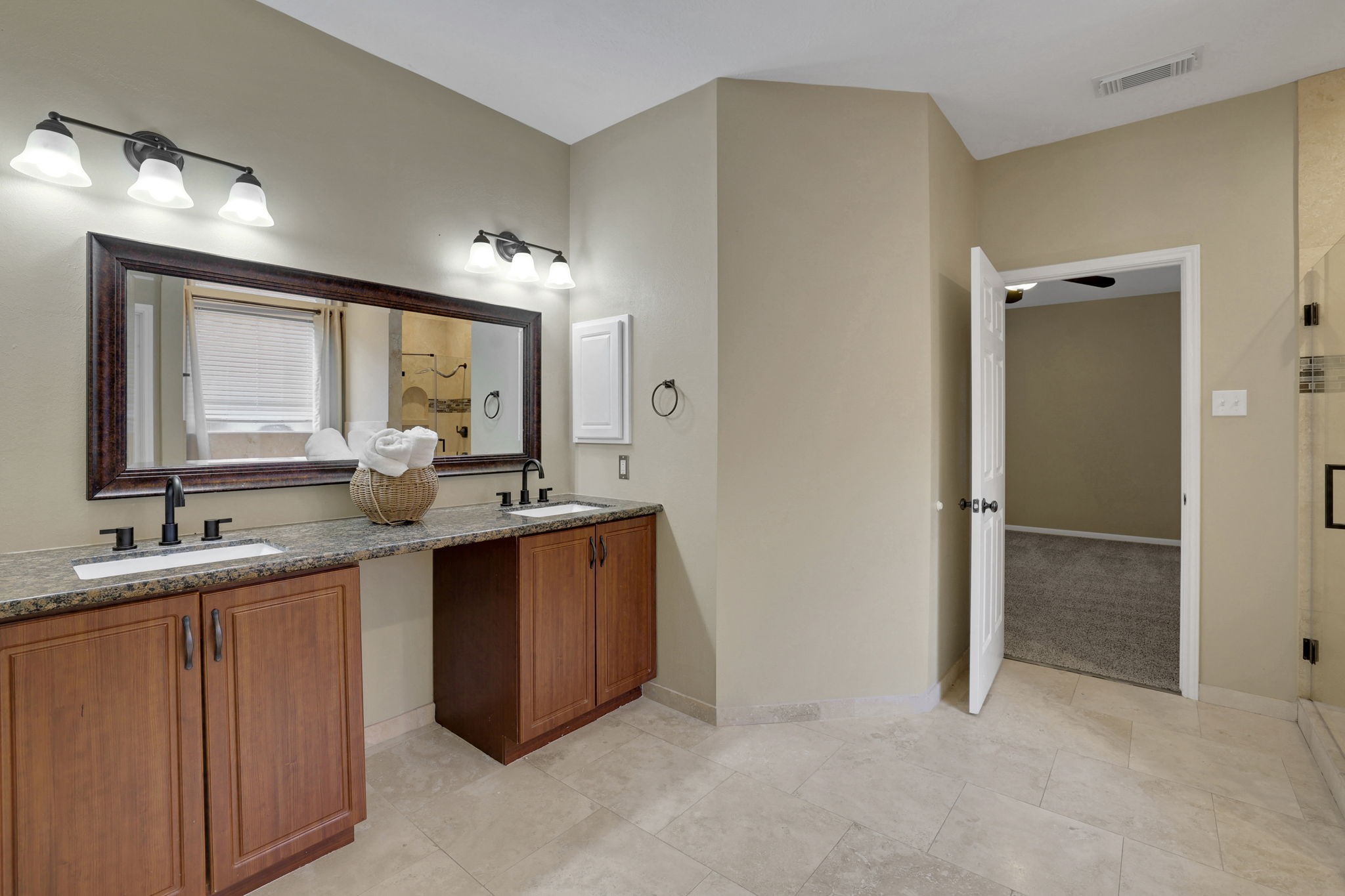 23207 Olive Ridge Court Katy, TX 77494 - Photo 22 of 46 a bathroom with a double vanity sink and mirror