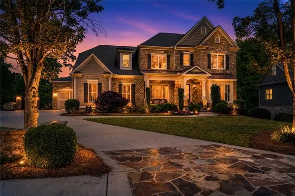 a front view of a house with a yard