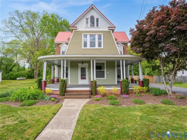a front view of a house with a yard table and chairs