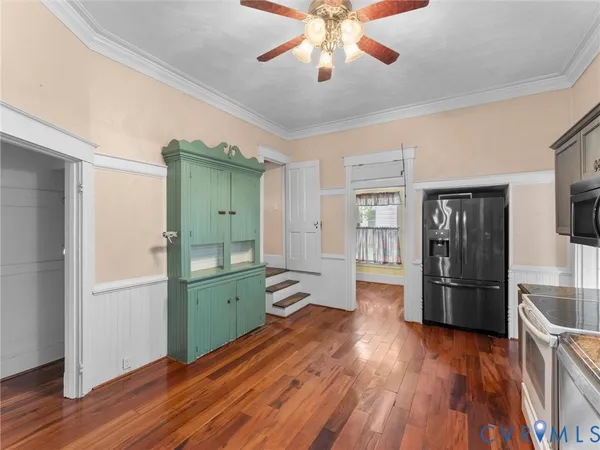 a view of a kitchen cabinets and wooden floor