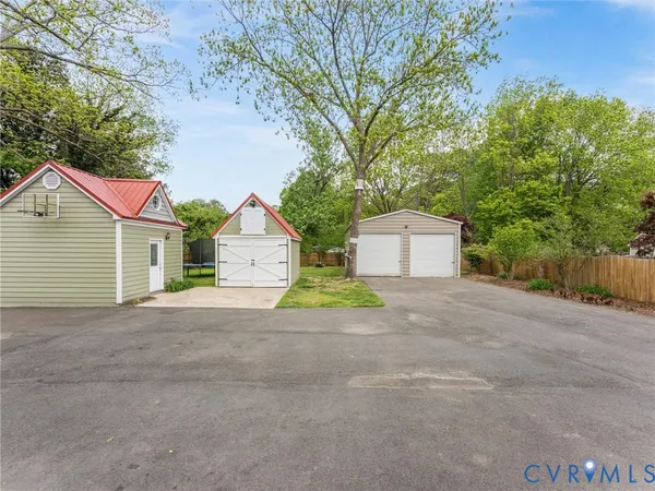 a view of a house with a yard and garage