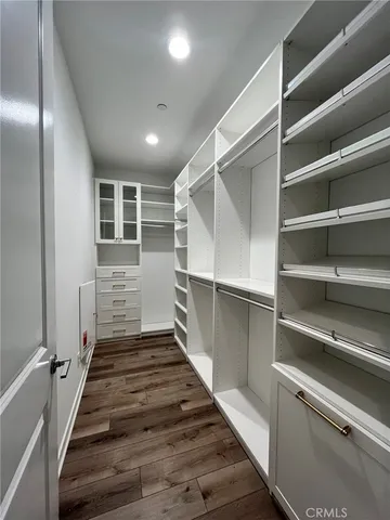 a bathroom with a double vanity sink mirror and shower