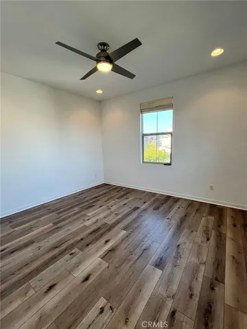 a view of a room with stairs and a floor to ceiling window
