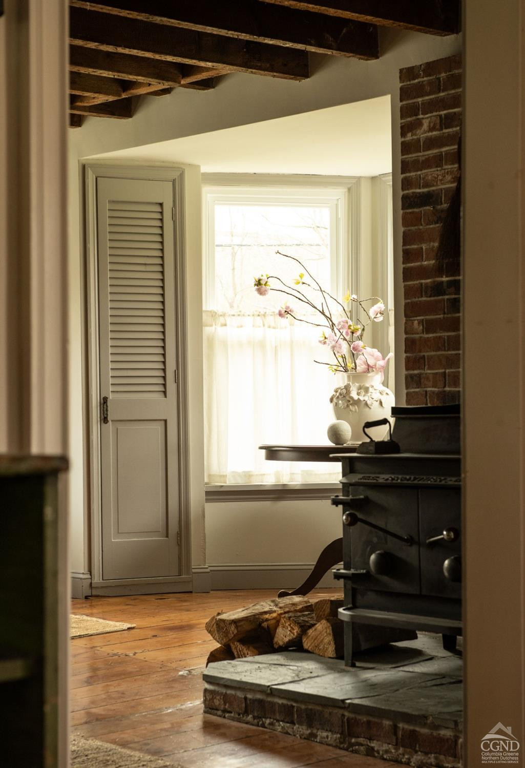 50 Lockwood Road Craryville, NY 12521 - Photo 11 of 25 a living room with a table and a window