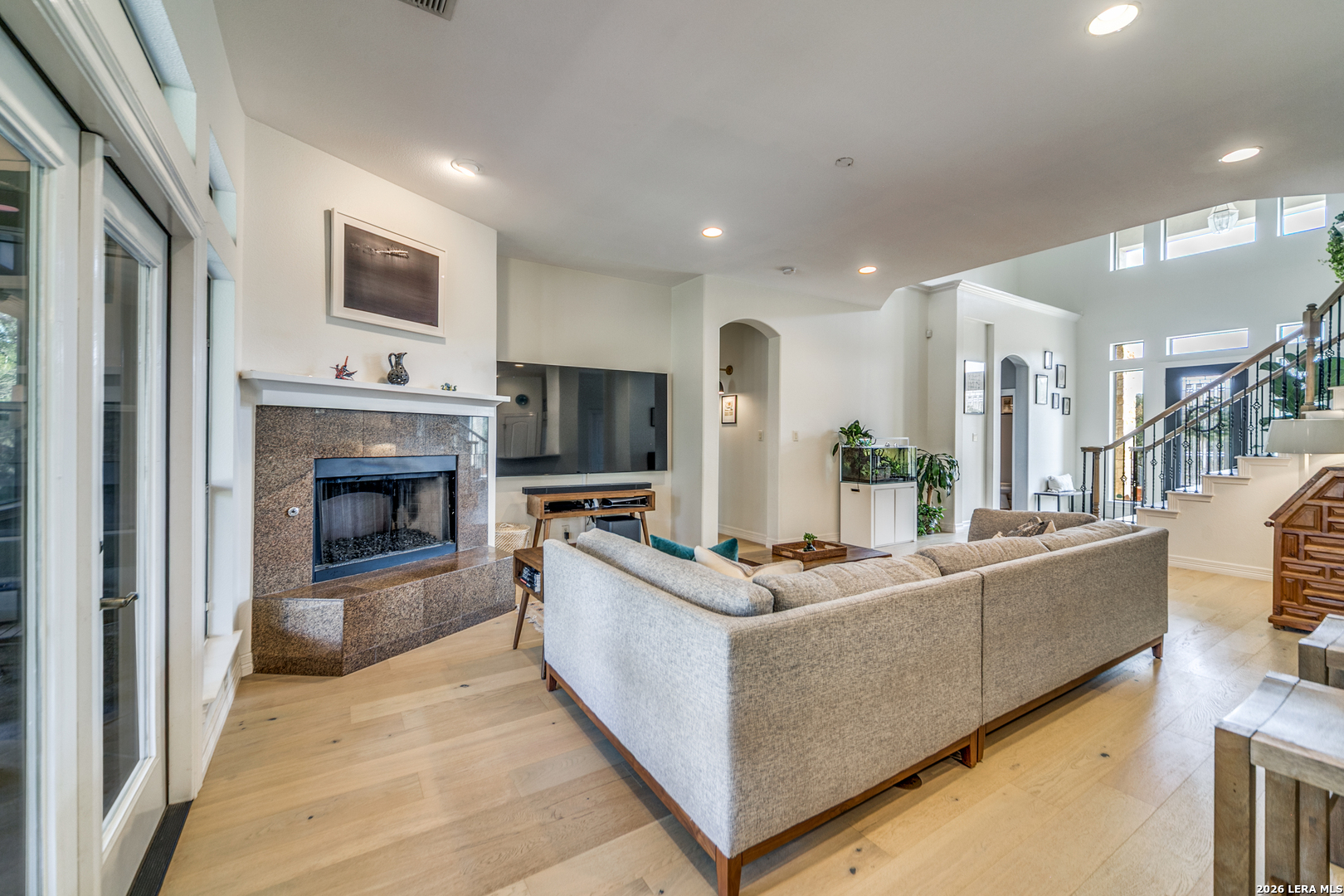 643 Ridge San Antonio, TX 78258 - Photo 15 of 45 a living room with furniture a flat screen tv and a fireplace