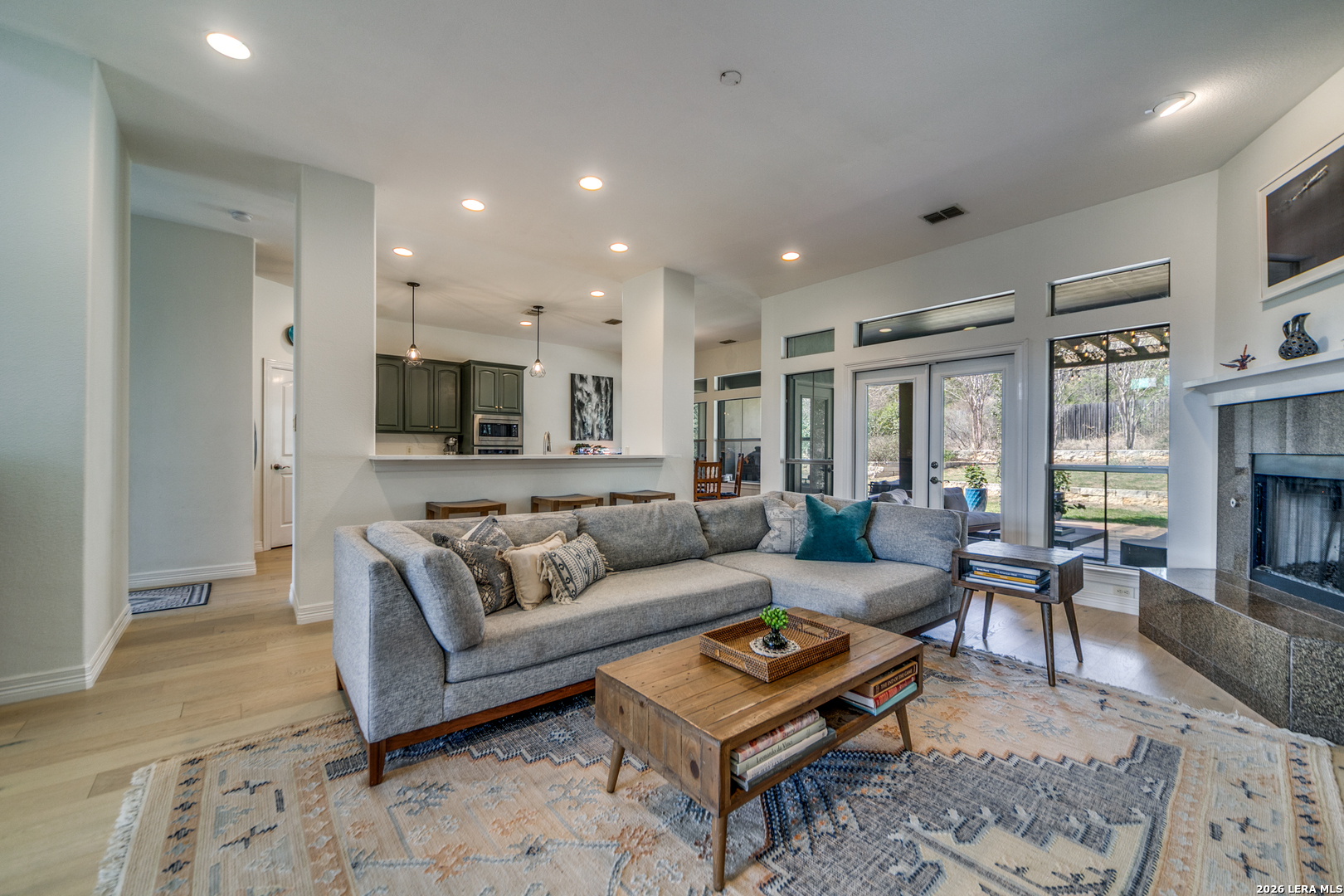 643 Ridge San Antonio, TX 78258 - Photo 17 of 45 a living room with furniture a fireplace and a table