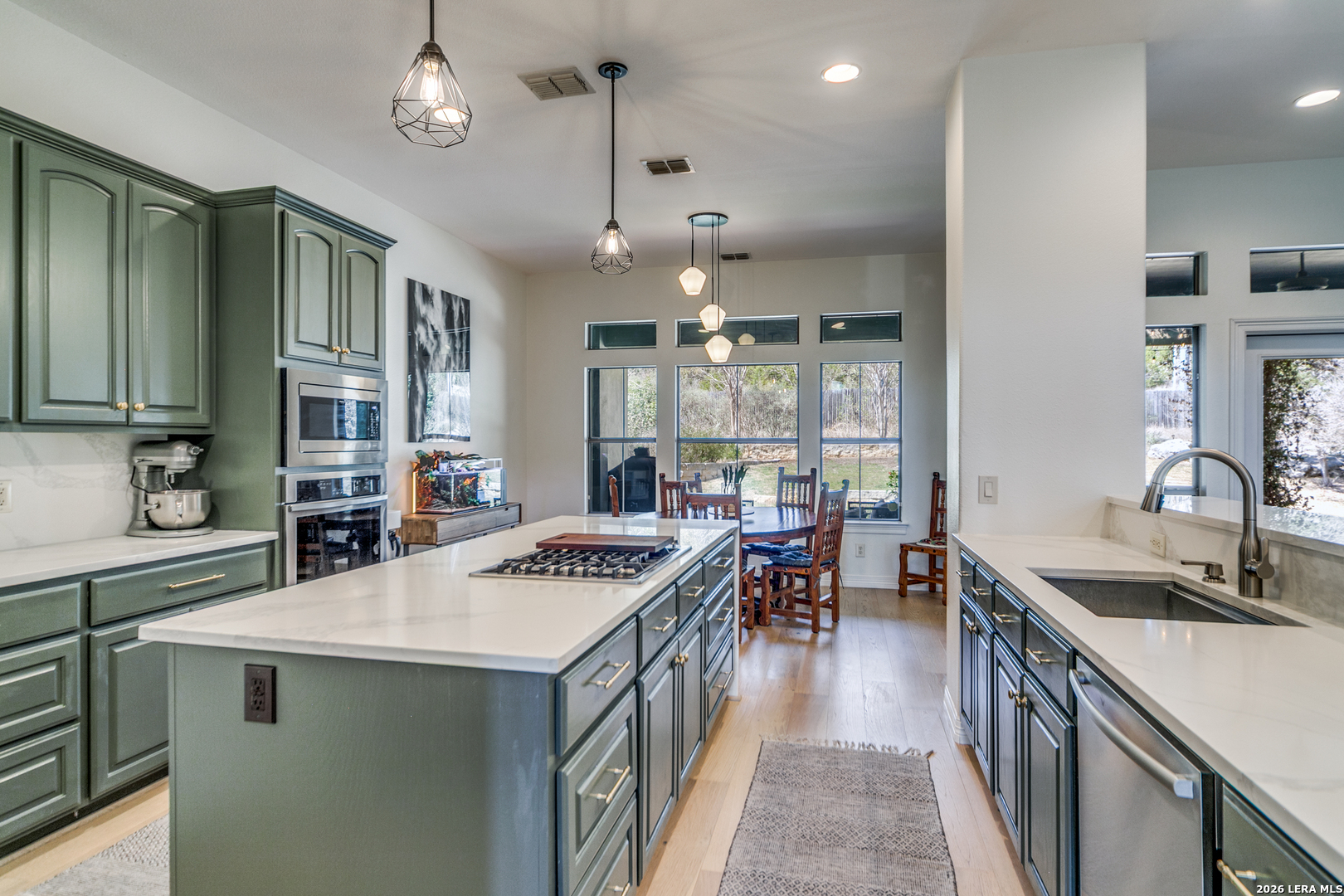 643 Ridge San Antonio, TX 78258 - Photo 18 of 45 a kitchen with a stove and a sink