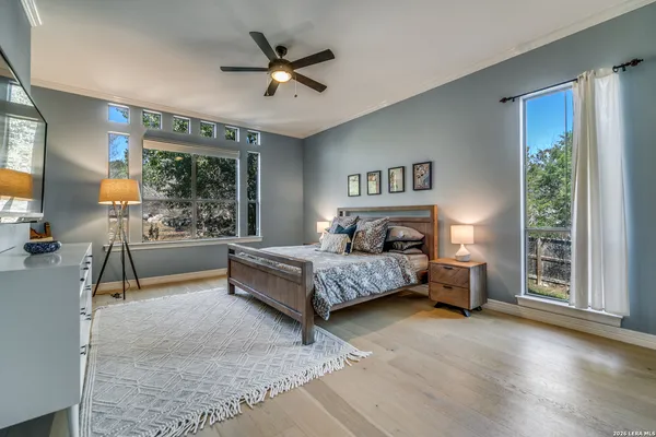 a bedroom with a large bed and a couch