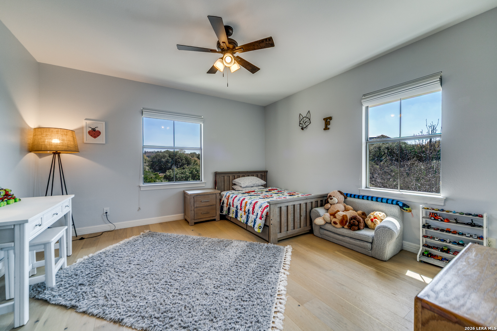 643 Ridge San Antonio, TX 78258 - Photo 36 of 45 a bedroom with furniture and a window