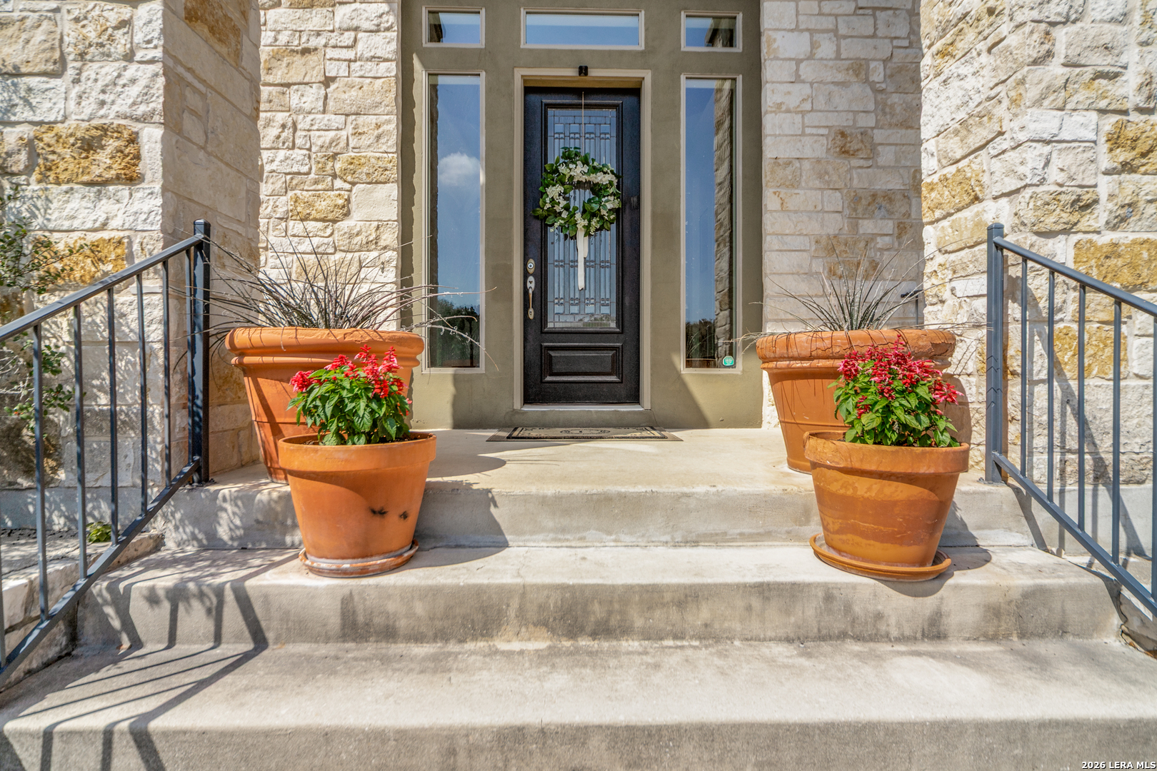 643 Ridge San Antonio, TX 78258 - Photo 4 of 45 a view of a white building with potted plants
