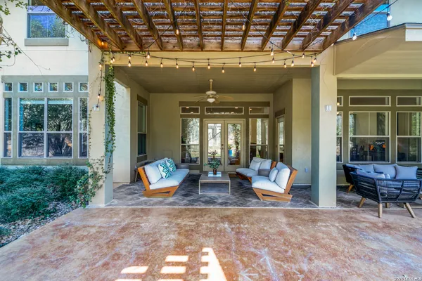 a outdoor space with patio lots of furniture and windows