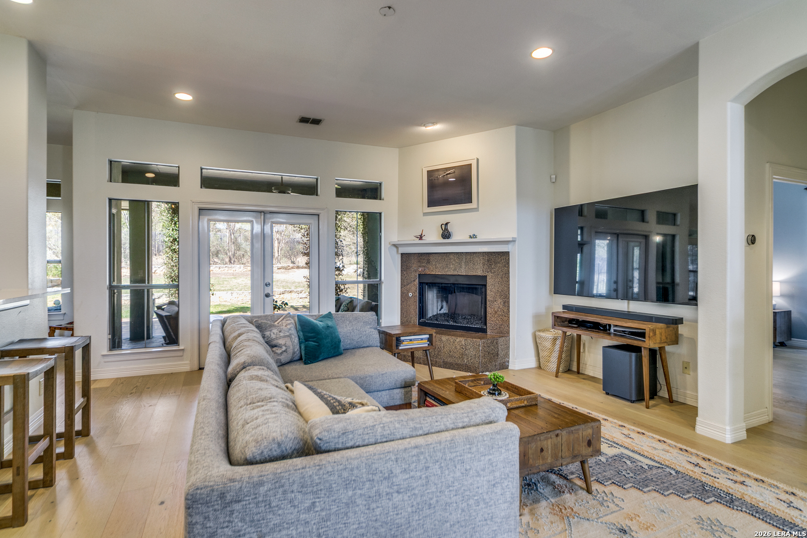 643 Ridge San Antonio, TX 78258 - Photo 7 of 45 a living room with furniture flat screen tv and a fireplace