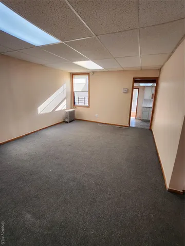 a view of a hallway with a window