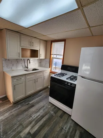 a kitchen with a stove and a sink