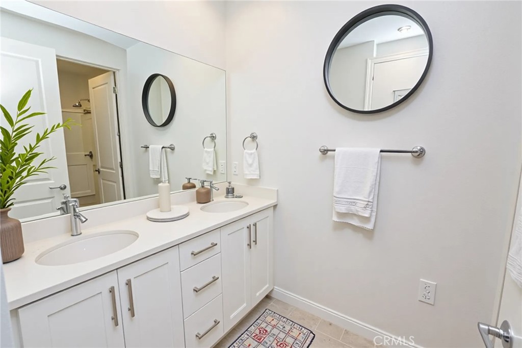 39824 Ninebark Court Temecula, CA 92591 - Photo 20 of 32 a bathroom with a sink and a mirror