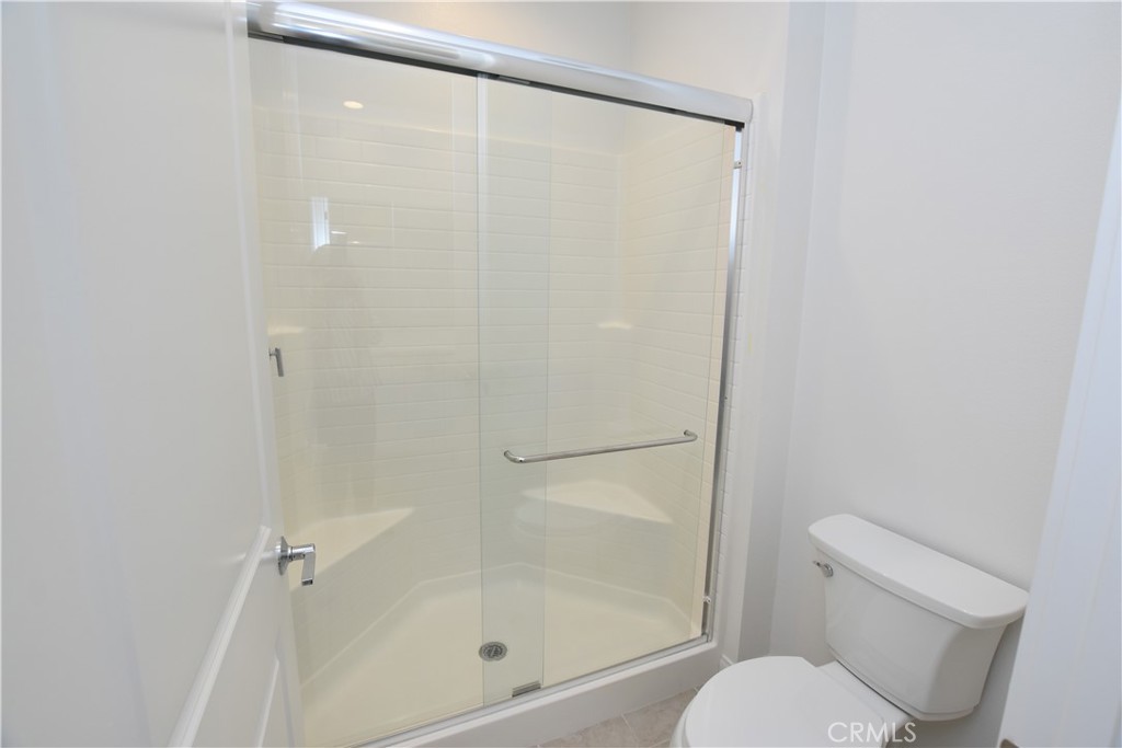 39824 Ninebark Court Temecula, CA 92591 - Photo 21 of 32 a bathroom with a shower and a toilet